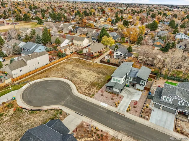 a view of a swimming pool with lawn chairs
