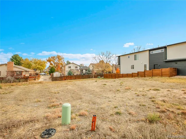 a view of a field with an ocean view