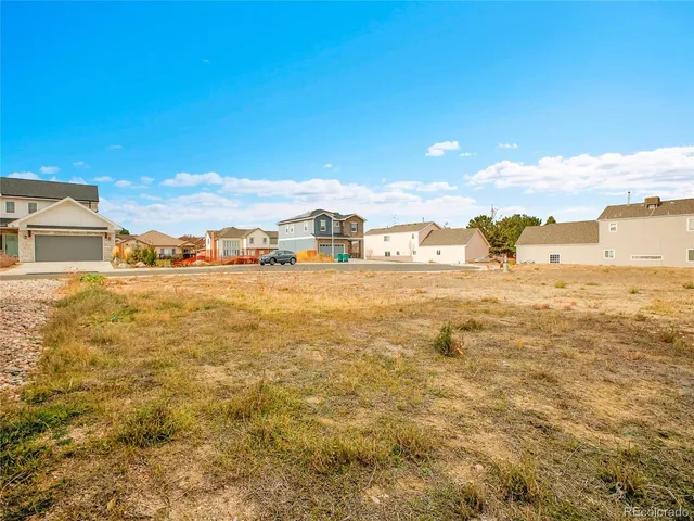 a view of ocean with yard