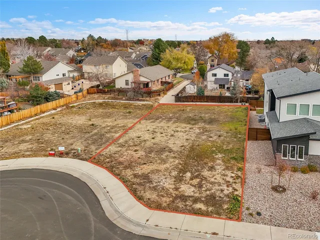 an aerial view of a house with swimming pool