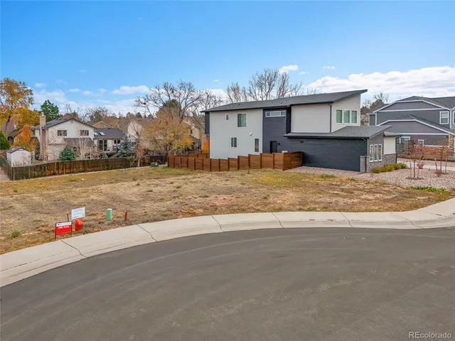 a view of a house with a snow on the road