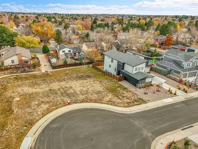 swimming pool view with a lake view