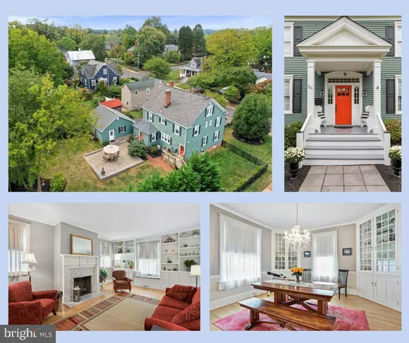 an aerial view of a house with swimming pool and large trees