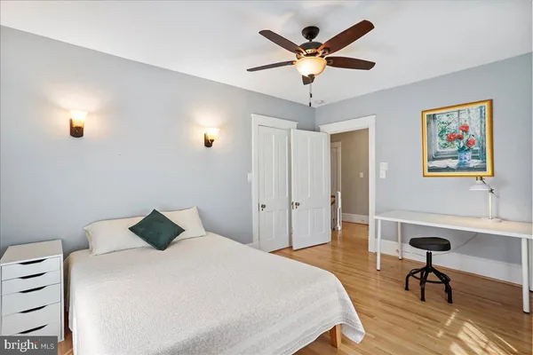 a bedroom with a bed and a dresser
