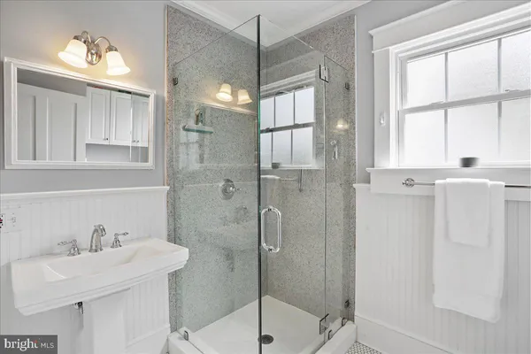 a view of a hallway with kitchen and entryway