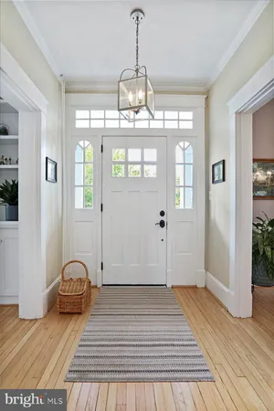 a view of a room with wooden floor and window