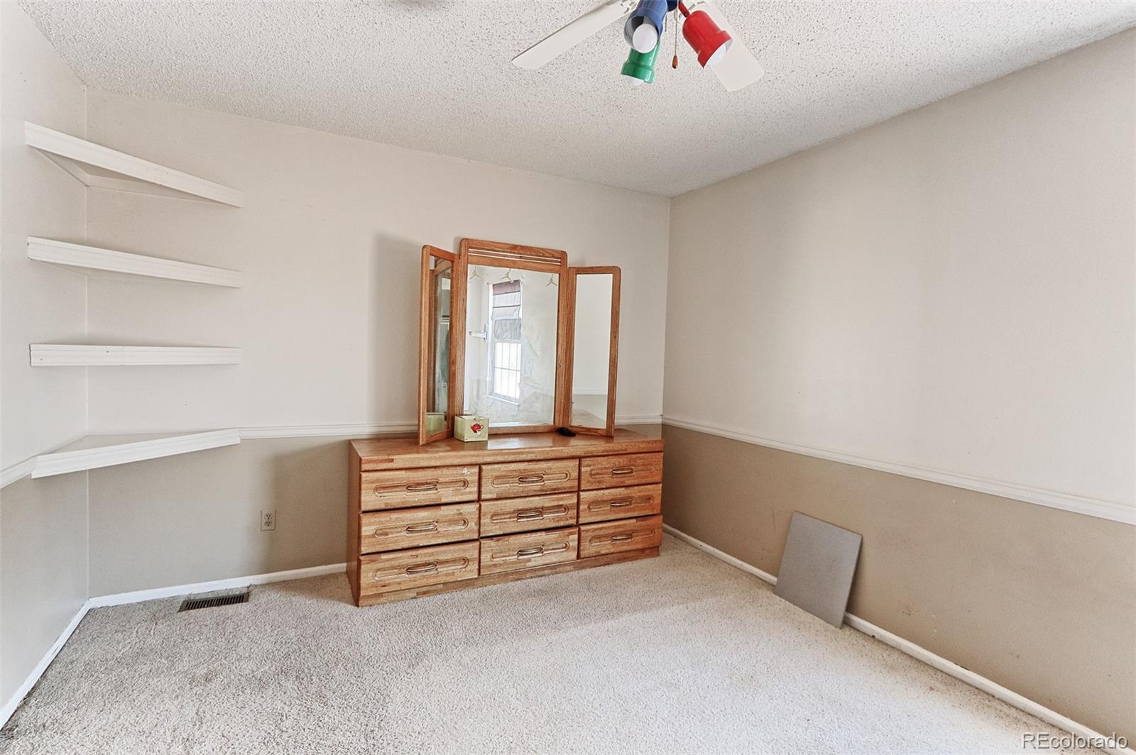 12133 Bannock Circle, Unit B Westminster, CO 80234 - Photo 11 of 14 a view of an empty room with cabinet and stairs