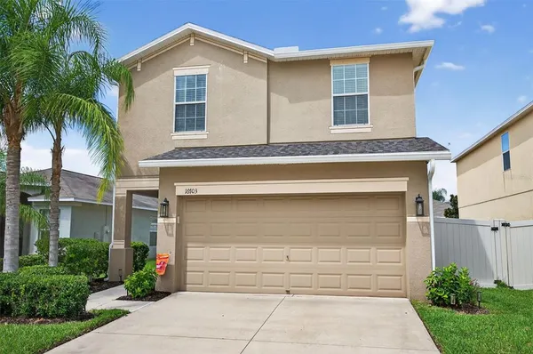 a front view of a house with a garage