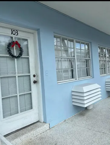 a view of bench in front of a house