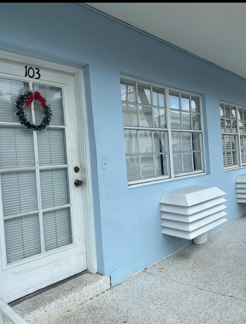 a view of bench in front of a house