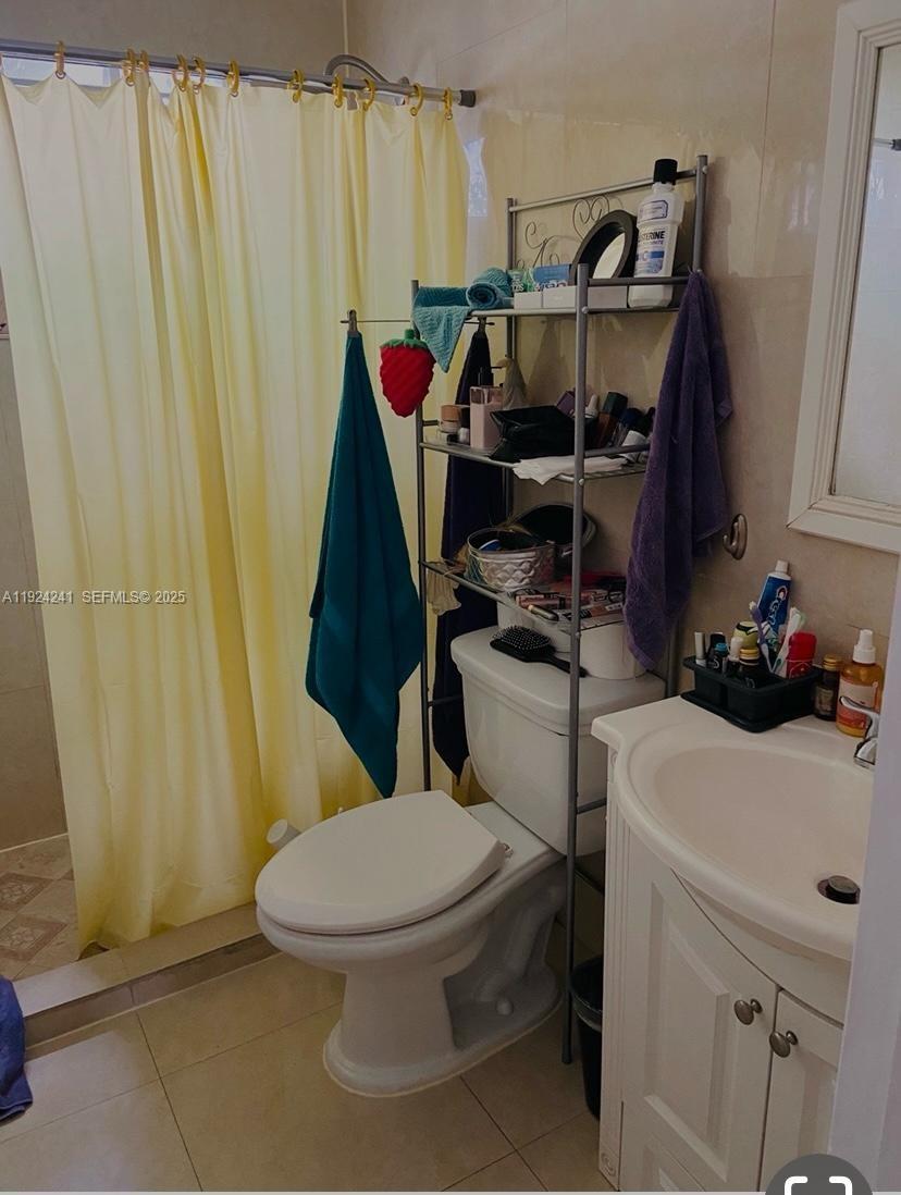 635 8th Street, Unit 103 Miami Beach, FL 33139 - Photo 6 of 6 a bathroom with a sink and a toilet