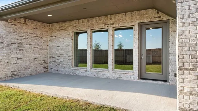 a view of a brick house with a large window
