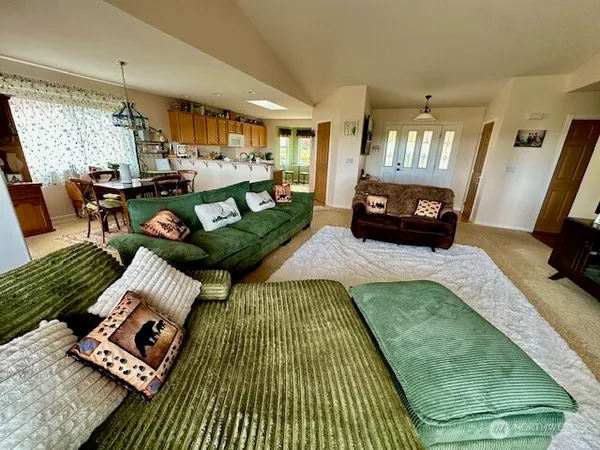a view of a living room with a large window