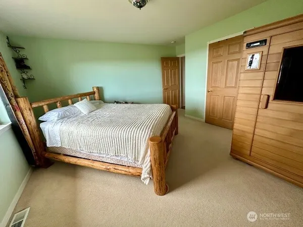 a bedroom with a bed and window