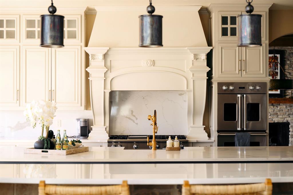 9930 Boat Club Road Fort Worth, TX 76179 - Photo 13 of 40 The Main House kitchen offers elegant finishes, a large island, and premium appliances designed for both style and function.
