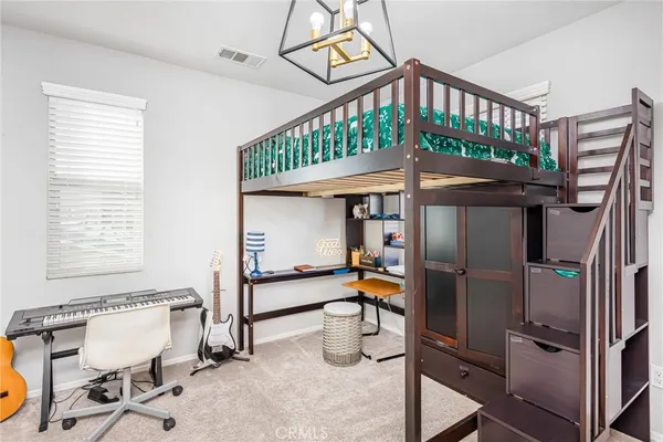 a bedroom with a bed and a table in it