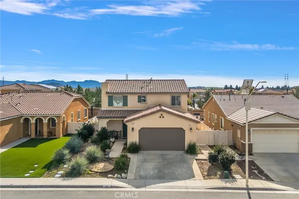 an aerial view of a house with a garden