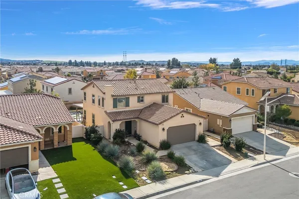an aerial view of residential houses with outdoor space