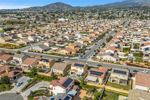 an aerial view of residential houses with outdoor space