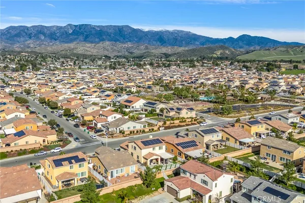 an aerial view of residential houses with outdoor space