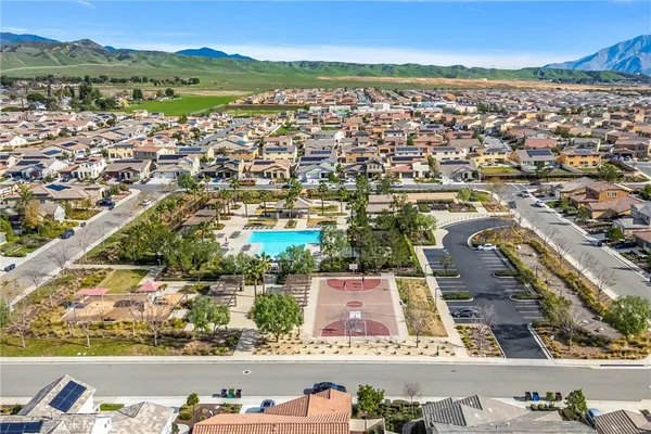an aerial view of residential houses with outdoor space