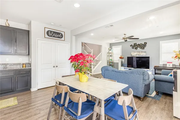 a view of a dining room with furniture and wooden floor
