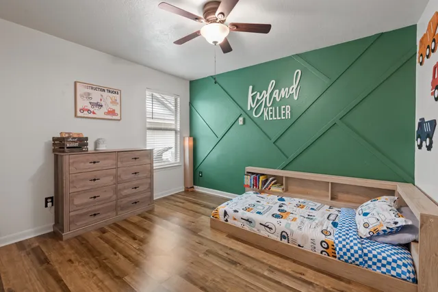 a bedroom with a bed and a dresser