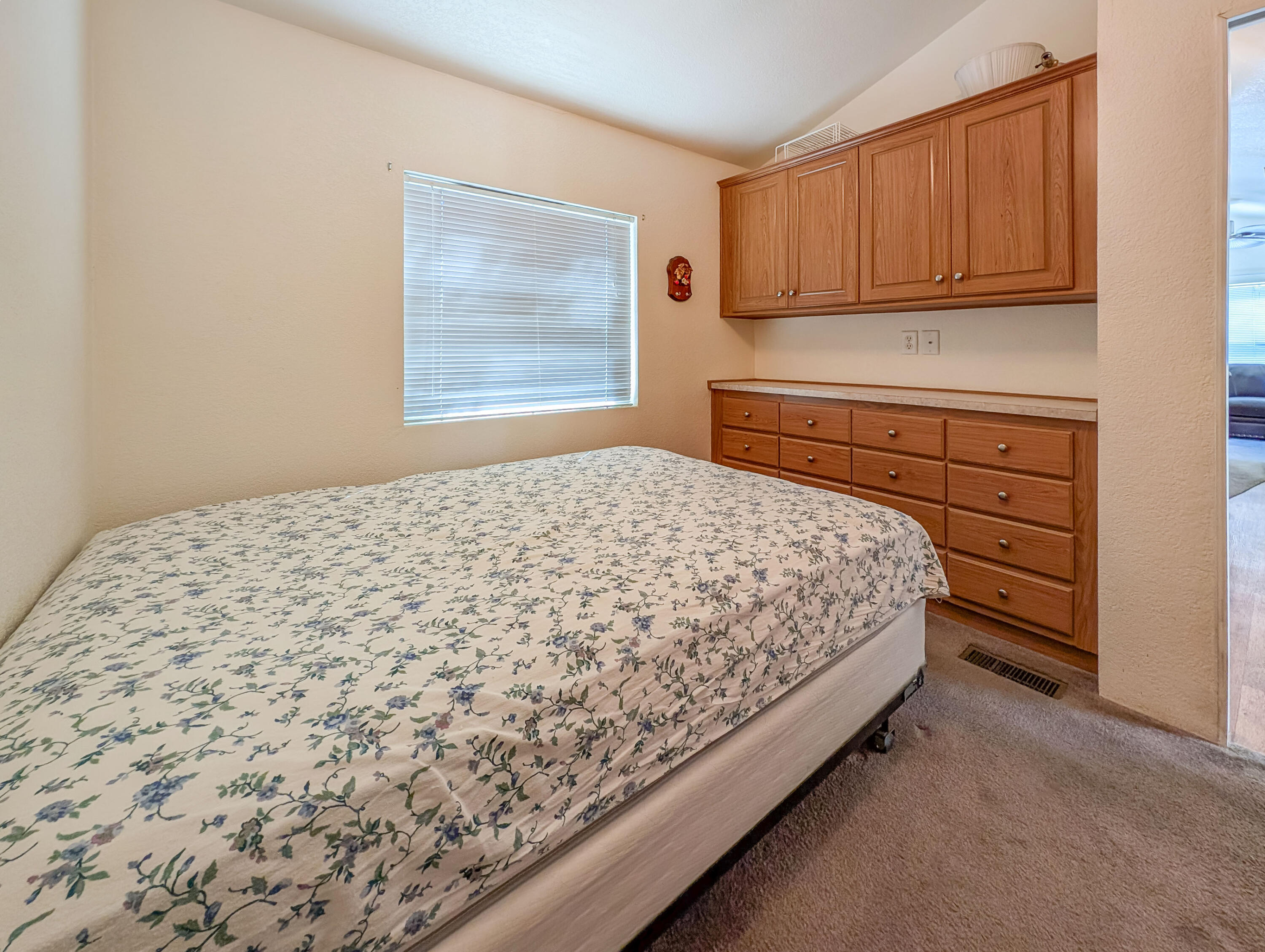70200 Dillon Road, Unit 169 Desert Hot Springs, CA 92241 - Photo 16 of 25 a bedroom with a bed and a window