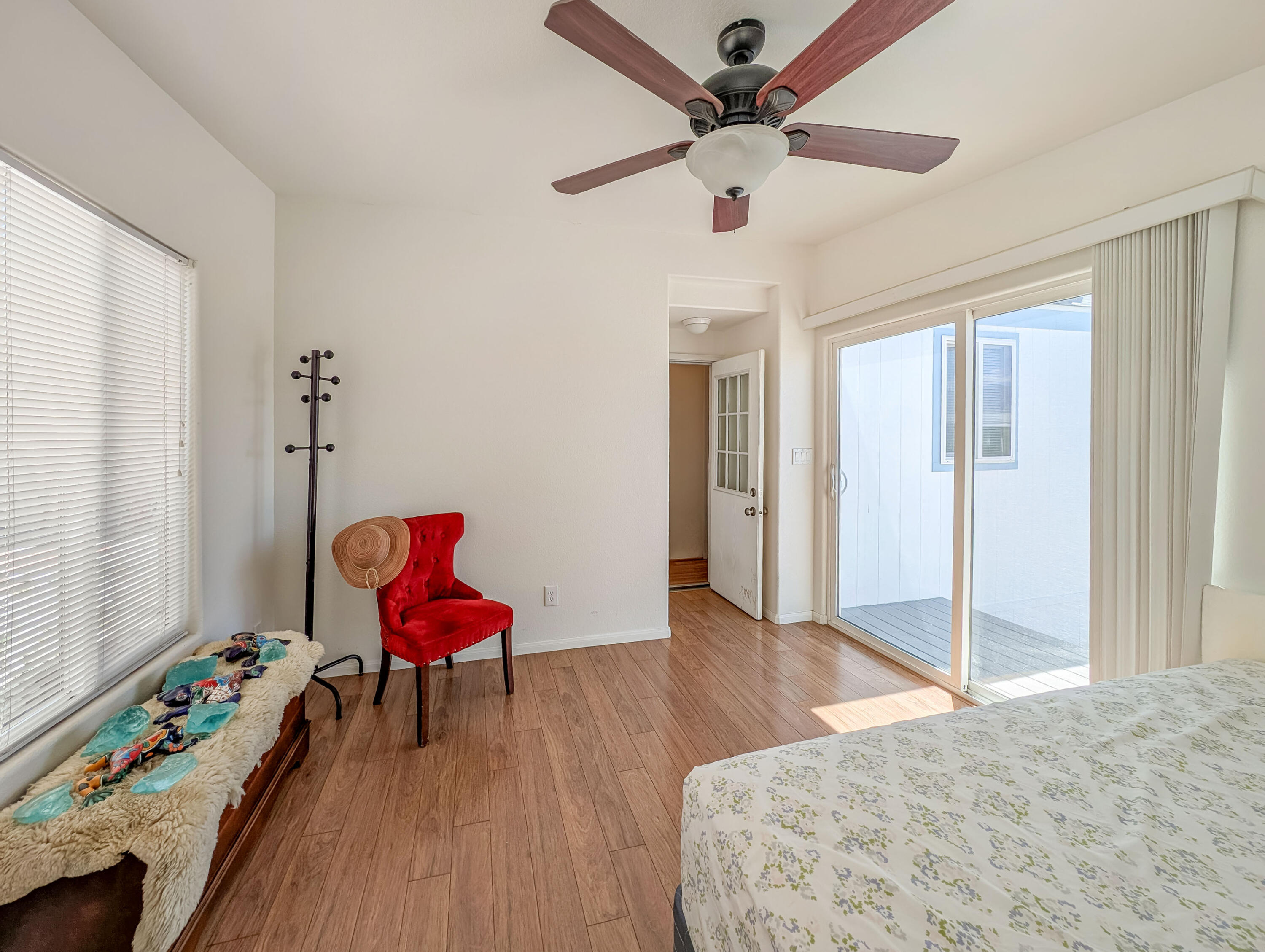 70200 Dillon Road, Unit 169 Desert Hot Springs, CA 92241 - Photo 19 of 25 a bedroom with furniture and a wooden floor