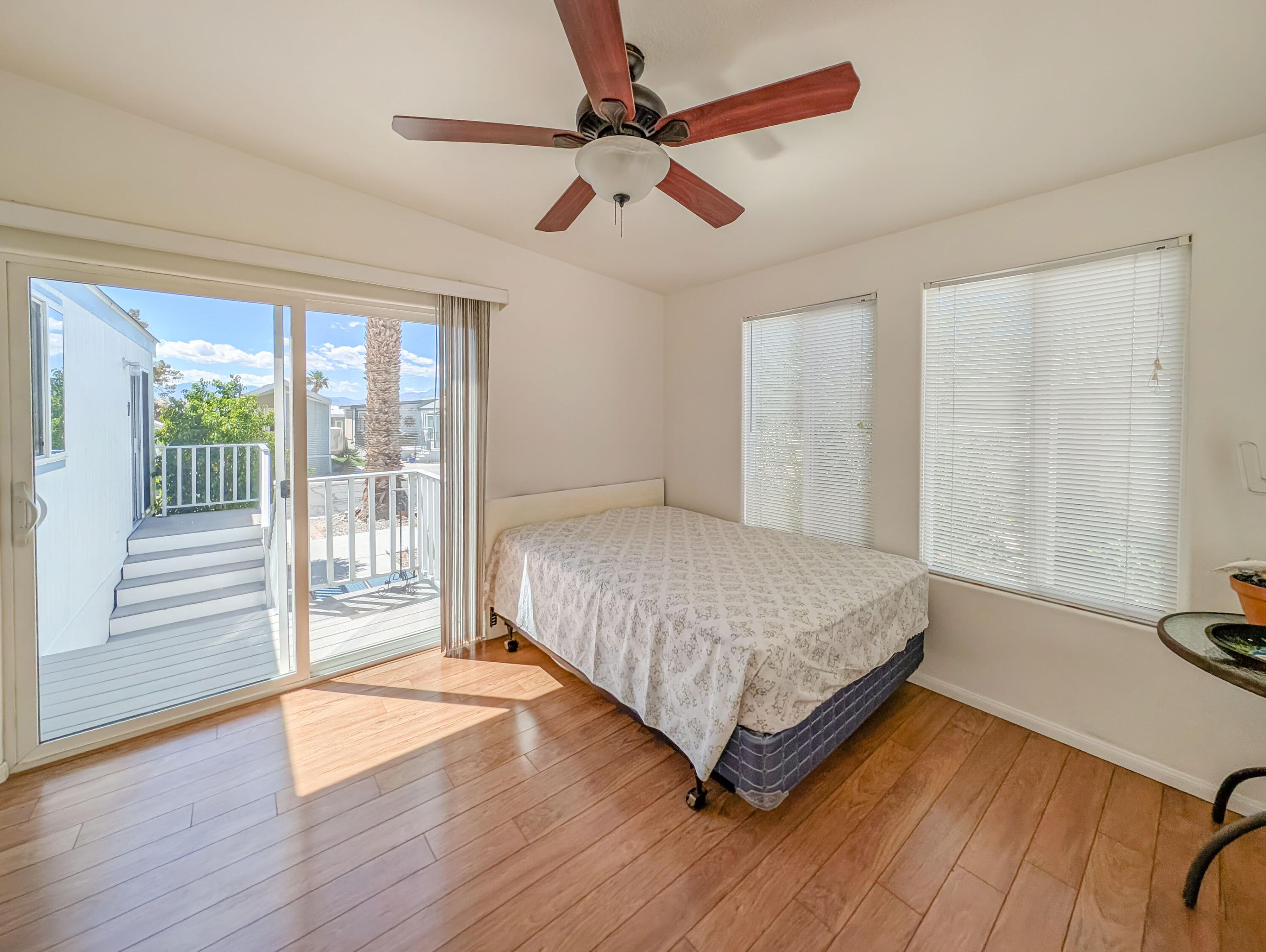 70200 Dillon Road, Unit 169 Desert Hot Springs, CA 92241 - Photo 20 of 25 a spacious bedroom with a bed and a dresser