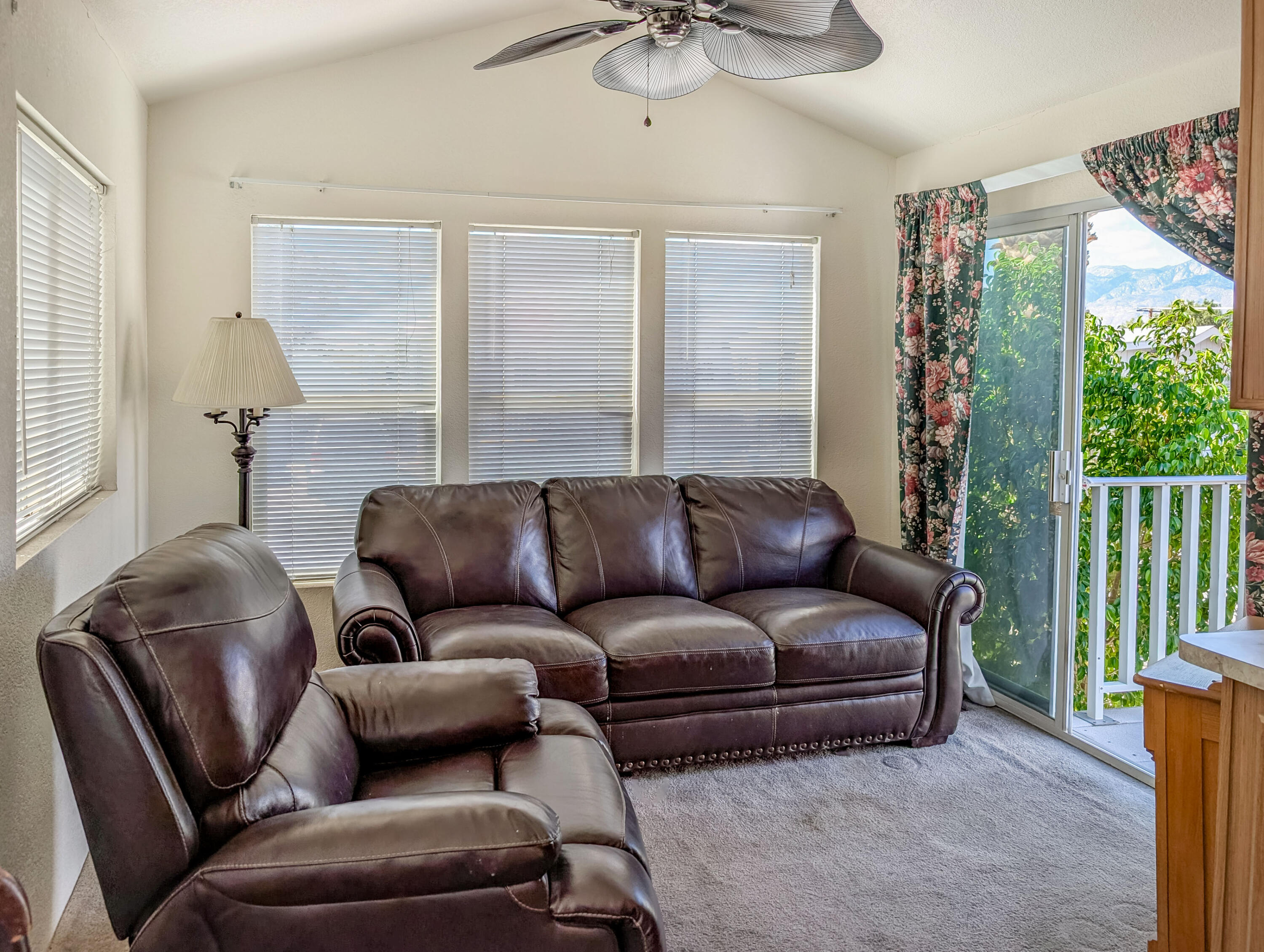 70200 Dillon Road, Unit 169 Desert Hot Springs, CA 92241 - Photo 6 of 25 a living room with furniture and a large window