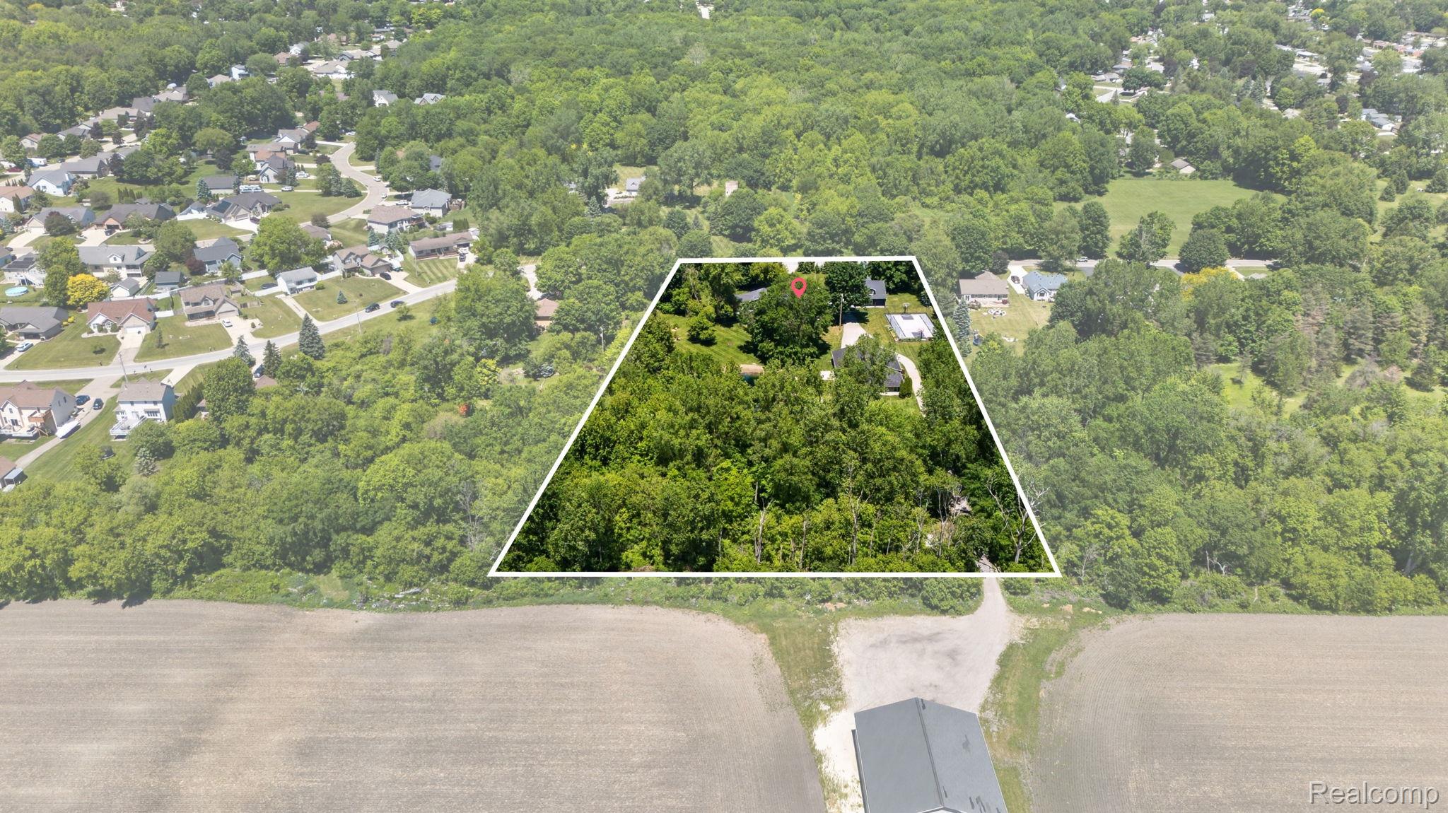 9353 Hill Road Swartz Creek, MI 48473 - Photo 95 of 98 Expansive wooded lot with a residential property featuring a gray roof