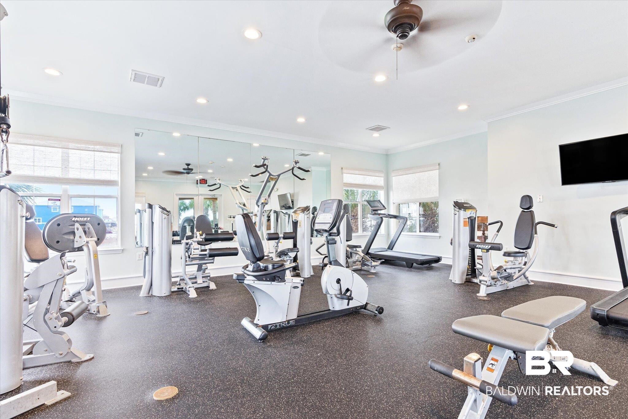 9259 Genipa Way Gulf Shores, AL 36542 - Photo 50 of 72 Exercise room featuring ornamental molding and ceiling fan