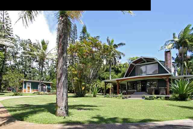 580 Awalau Road Haiku, HI 96708 - Photo 1 of 16 a front view of a house with garden