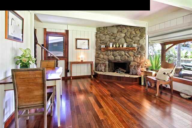 580 Awalau Road Haiku, HI 96708 - Photo 6 of 16 a living room with furniture and a fireplace