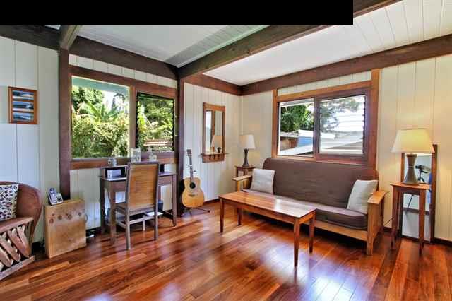 580 Awalau Road Haiku, HI 96708 - Photo 8 of 16 a living room with furniture and a wooden floor