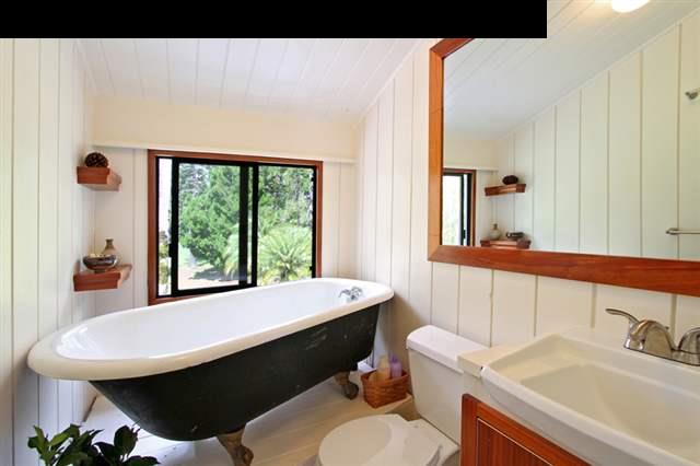 580 Awalau Road Haiku, HI 96708 - Photo 10 of 16 a bathroom with a sink and a mirror