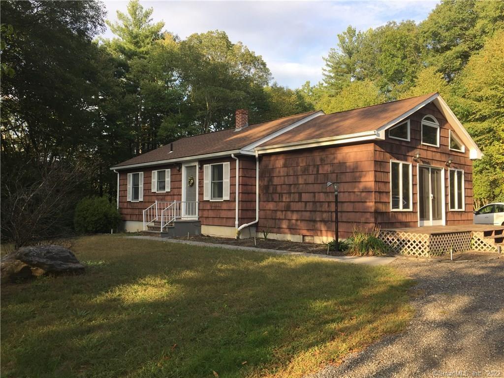85 Reardon Road Thompson, CT 06255 - Photo 1 of 1 a front view of a house with a yard