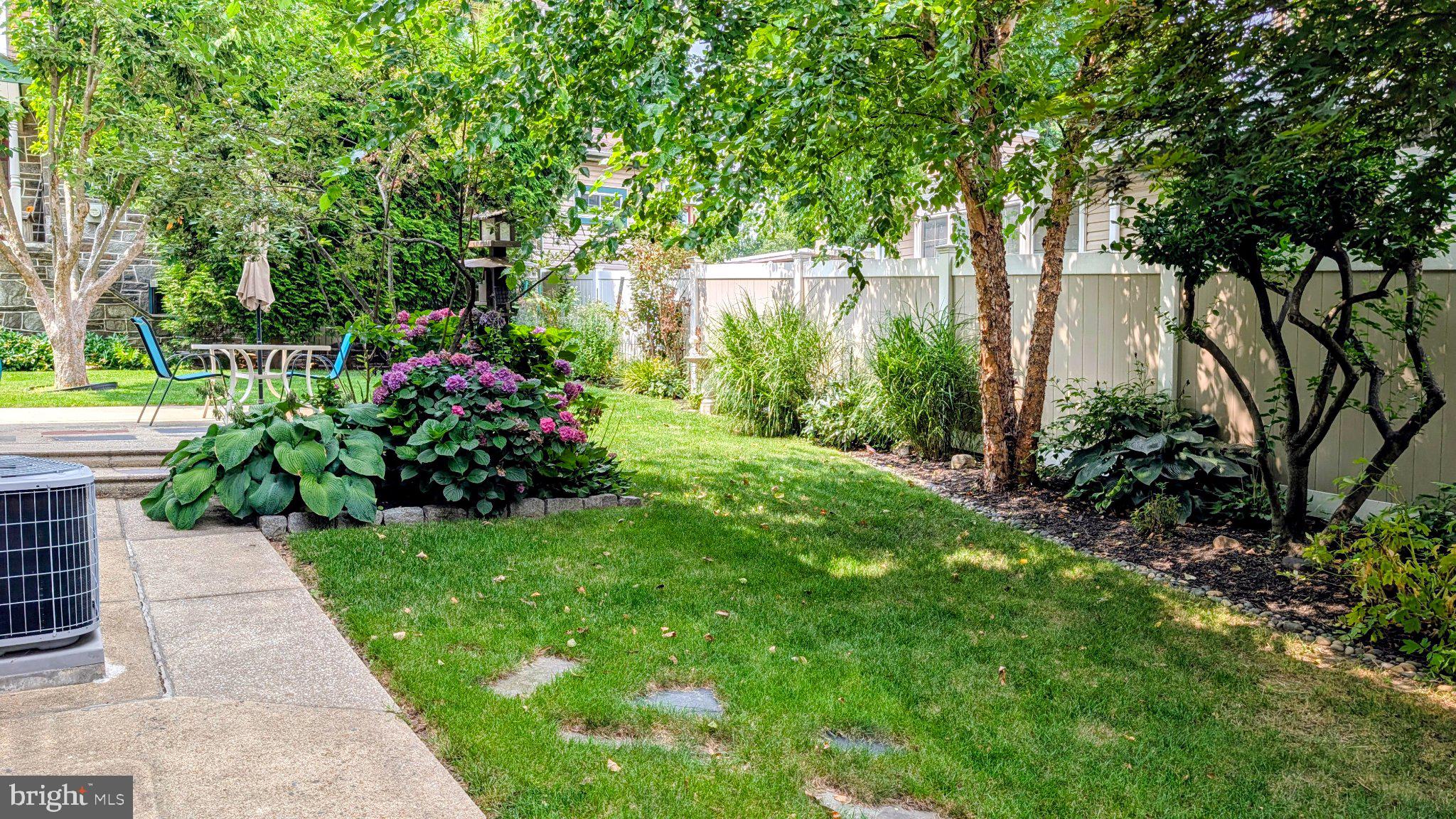 333 West Ridley Avenue Ridley Park, PA 19078 - Photo 5 of 32 Lush garden oasis with vibrant blooms.