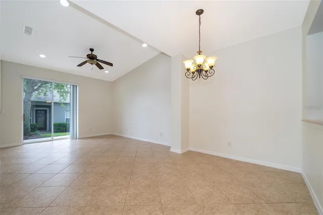 a view of a hallway with a chandelier