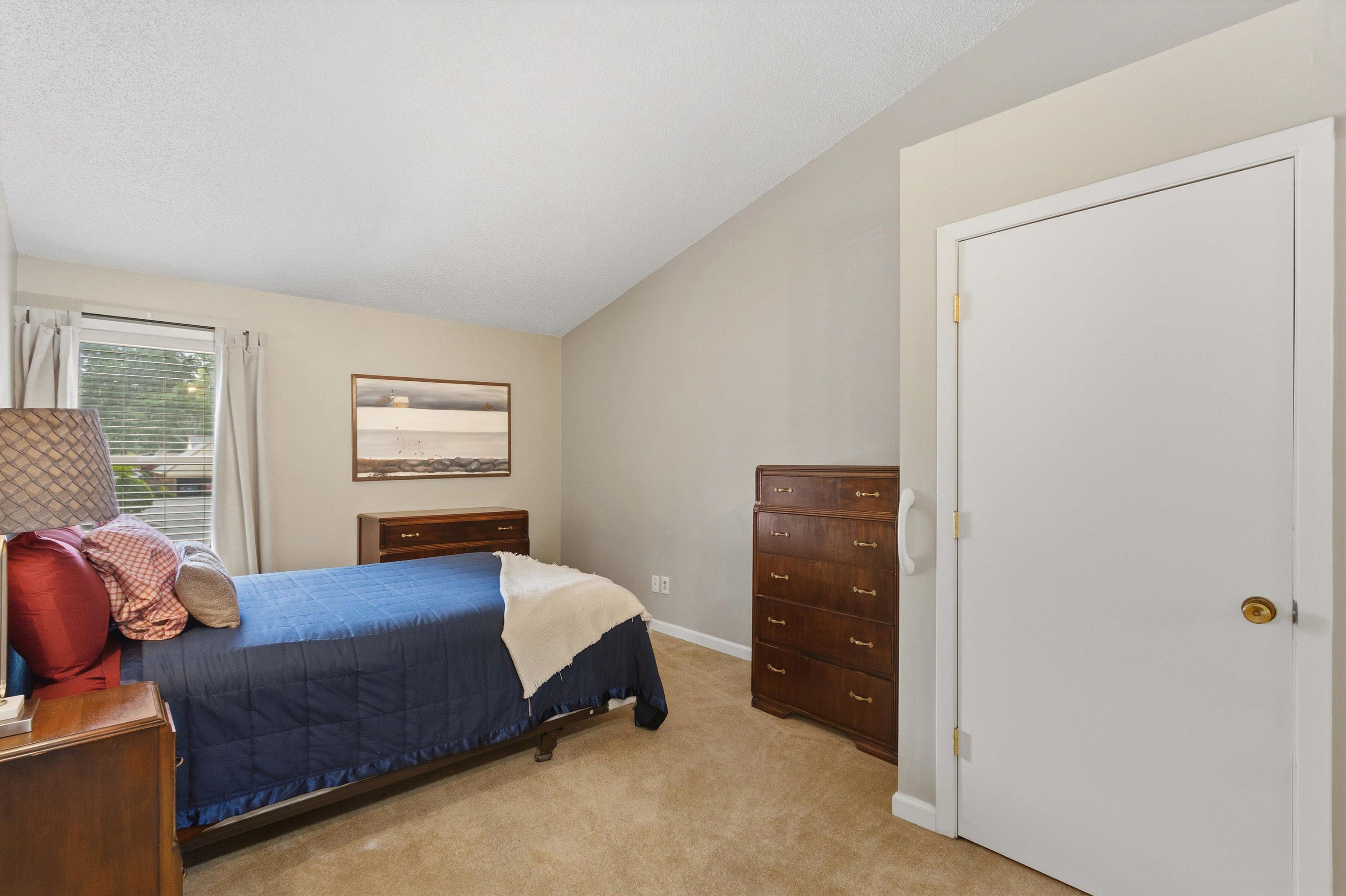 1906 Allenby Road, Unit 16 Germantown, TN 38139 - Photo 18 of 31 Vaulted ceiling, neutral wall paint, carpeted flooring, white trim, and a window with blinds
