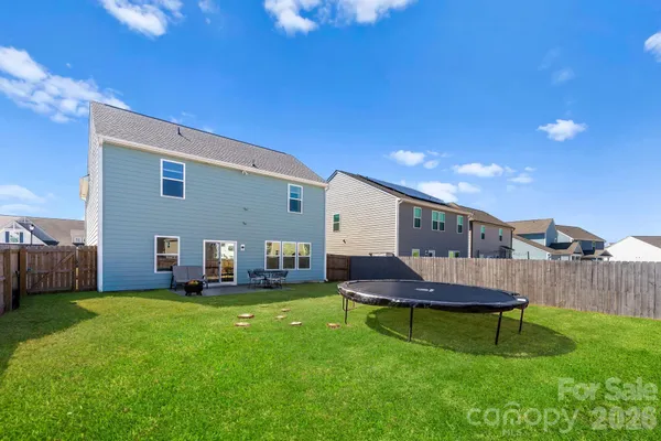 a view of a house with a yard porch and sitting area
