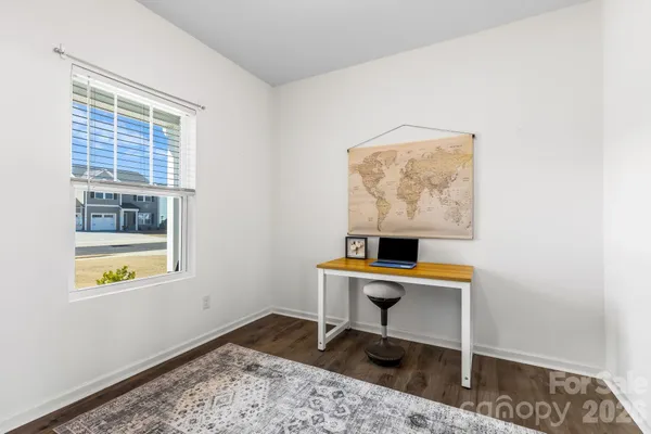 a workspace with furniture and a window