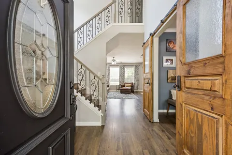 a view of an entryway with wooden floor