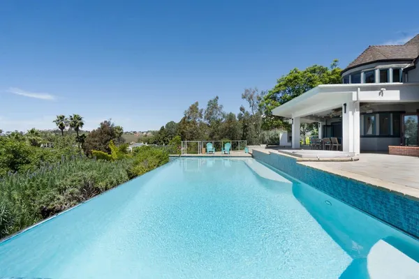 a view of a house with swimming pool
