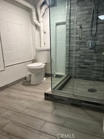 an empty room with chandelier fan