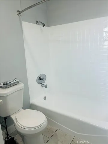 a living room with a black and white checkered floor