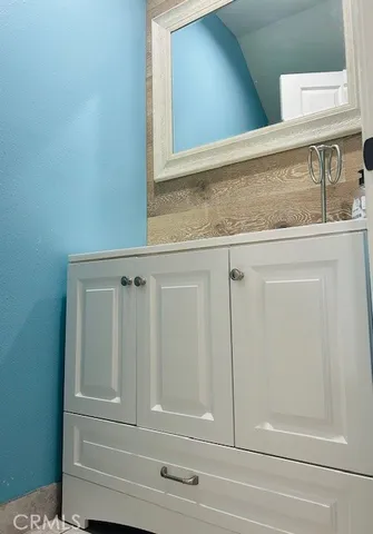 a bathroom with a sink and mirror