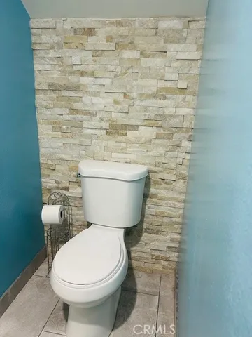 a bathroom with a toilet and a sink