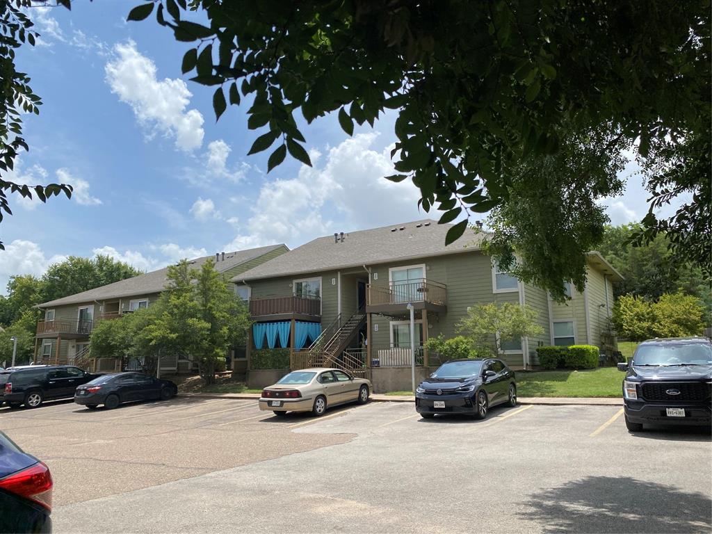 1500 Lake Shore Drive, Unit 213 Waco, TX 76708 - Photo 15 of 21 a car parked in front of a white house
